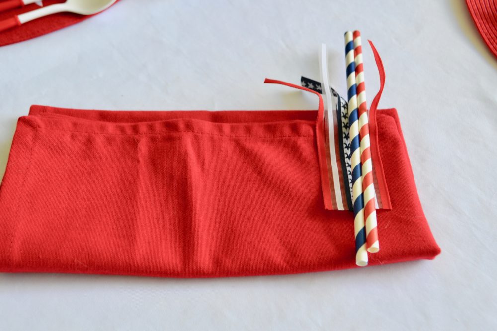 DIY Firecracker napkin fold for 4th of July table.