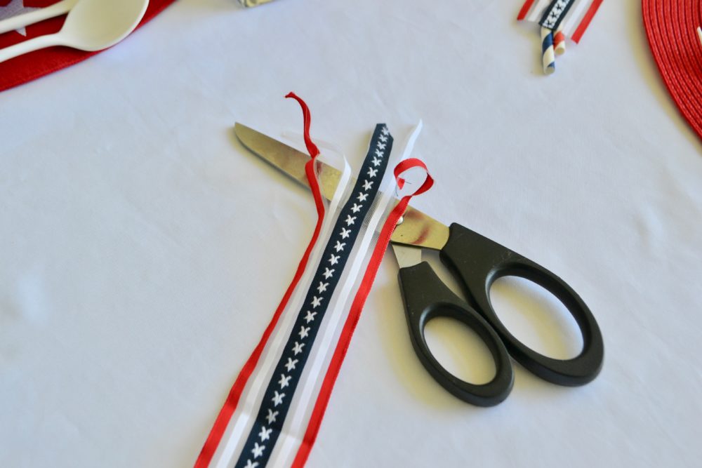 DIY Firecracker napkin fold for 4th of July table.