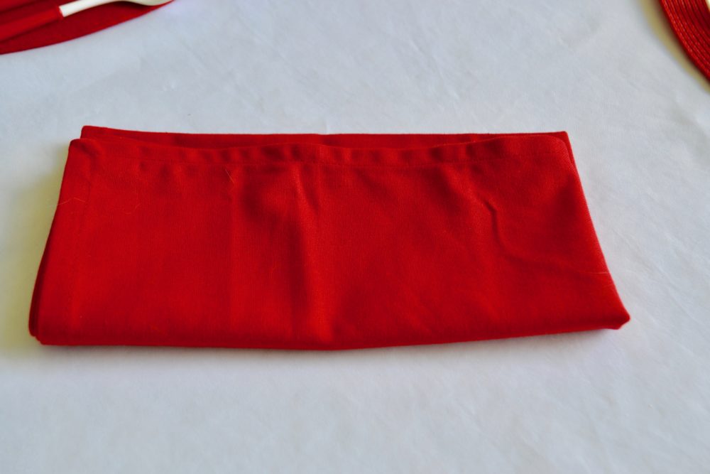 DIY Firecracker napkin fold for 4th of July table.