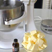 Making Swiss Meringue frosting adding butter lizbushong.com
