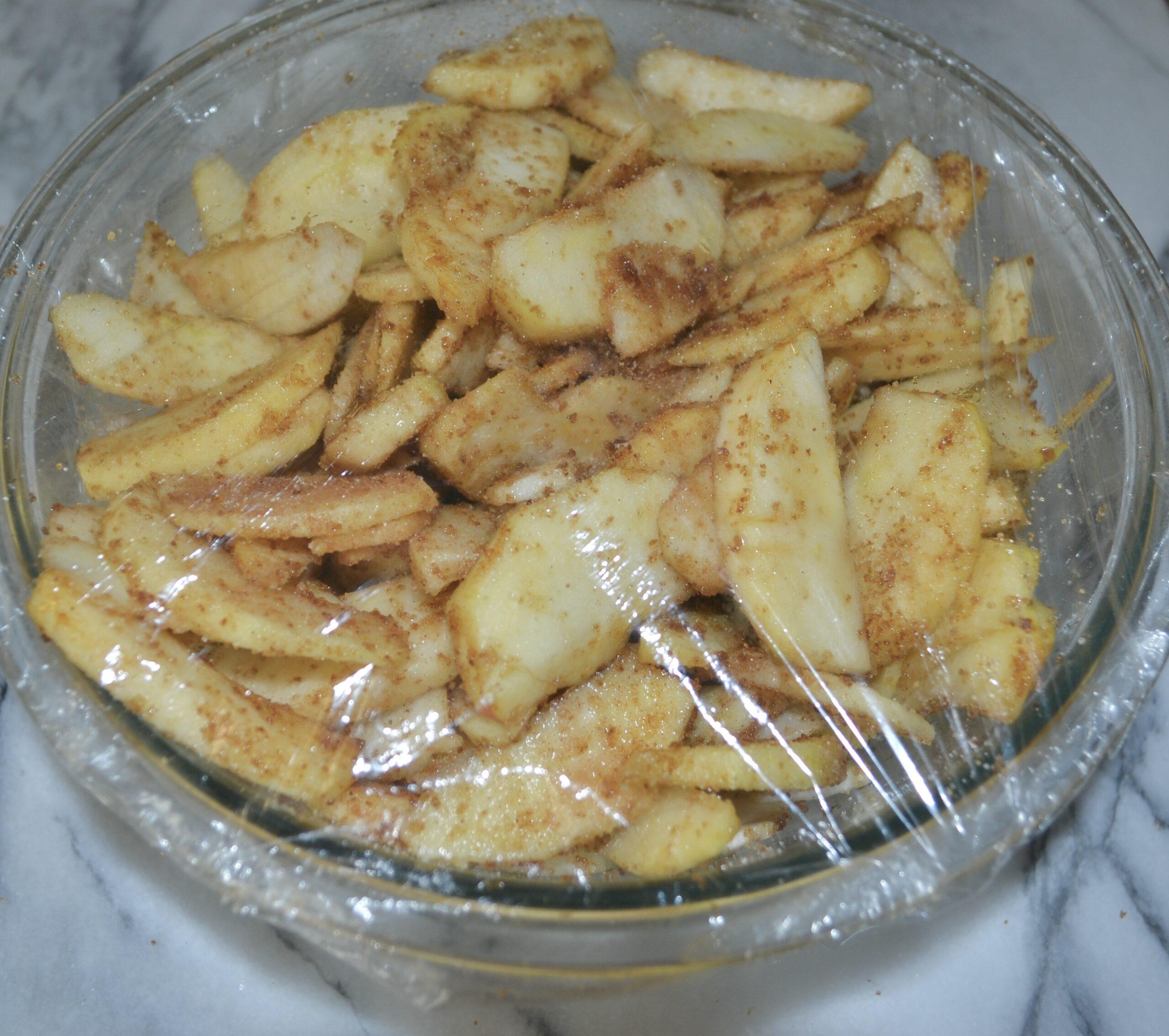 Sliced apples cinnamon sugar covered for pie