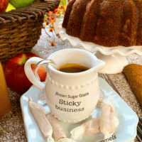 Apple Bundt Cake with Brown Sugar Glaze, Cinnamon Cream Cheese frosting dollops lizbushong.com